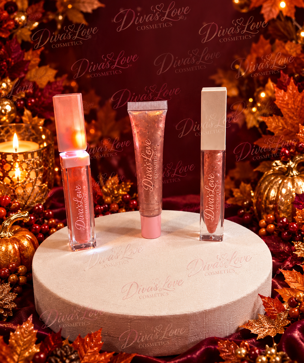 Three Diva's Rose Gold lip gloss formats on an autumn display