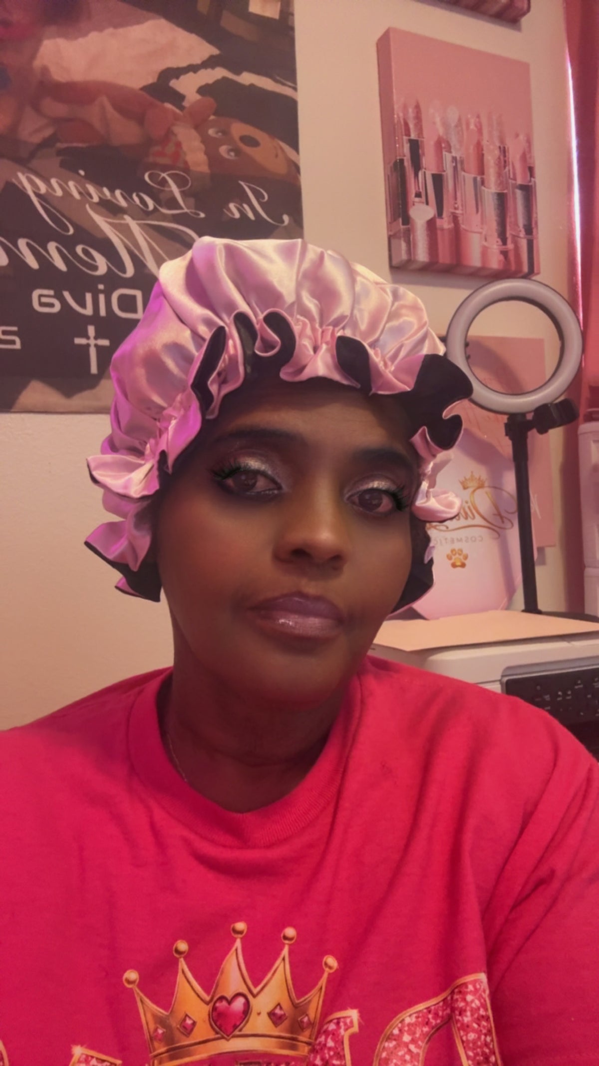 Model wearing pink side of reversible satin bonnet