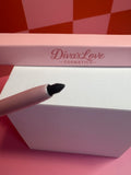 Diva's Love Cosmetics black lip liner with pink packaging on pink checkered background
